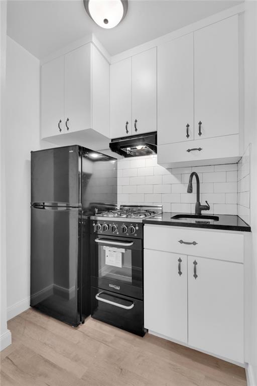 7259 Shore Road, Unit 2H Brooklyn, NY 11209 - Photo 7 of 9 a kitchen with stainless steel appliances granite countertop a refrigerator stove and sink