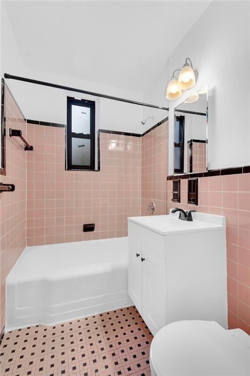 7259 Shore Road, Unit 2H Brooklyn, NY 11209 - Photo 8 of 9 a bathroom with a sink a toilet and shower