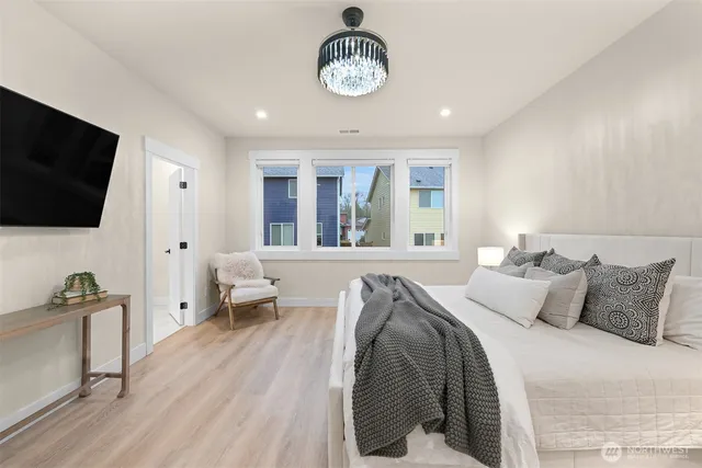 a bedroom with bed and a window