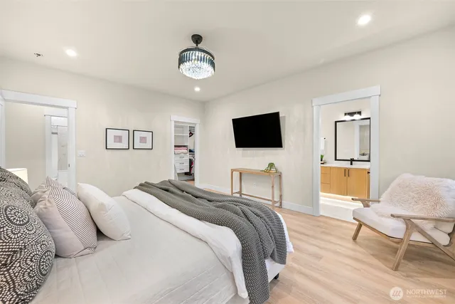 a bathroom with a shower sink and mirror