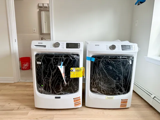 a utility room with washer and dryer