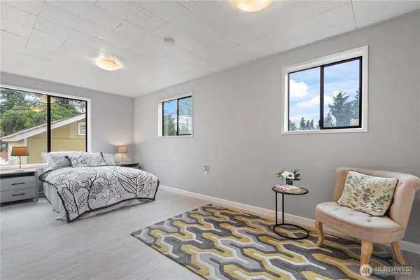 a bedroom with a bed and a couch