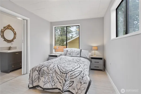 a bedroom with a bed and window