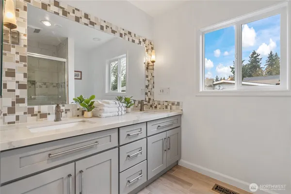 a bathroom with a shower and toilet