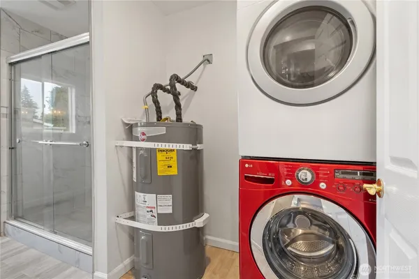 a view of a utility room with dryer and washer