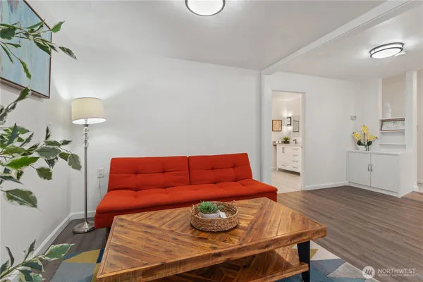 a view of a dining room with furniture and wooden floor