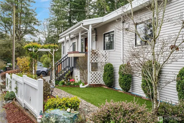a front view of a house with garden