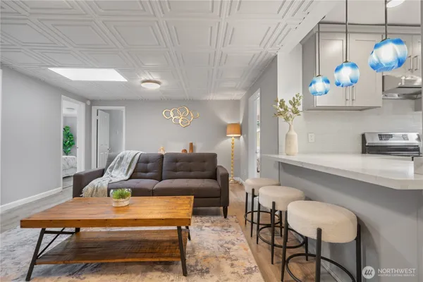 a living room with furniture and flowers