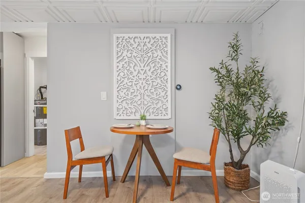 a view of a livingroom with furniture and a potted plant