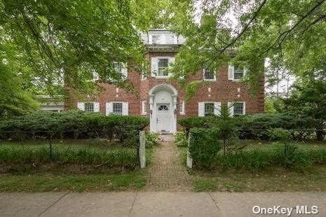 29-31 Arleigh Road Great Neck, NY 11021 - Photo 1 of 1 a front view of a house with a garden