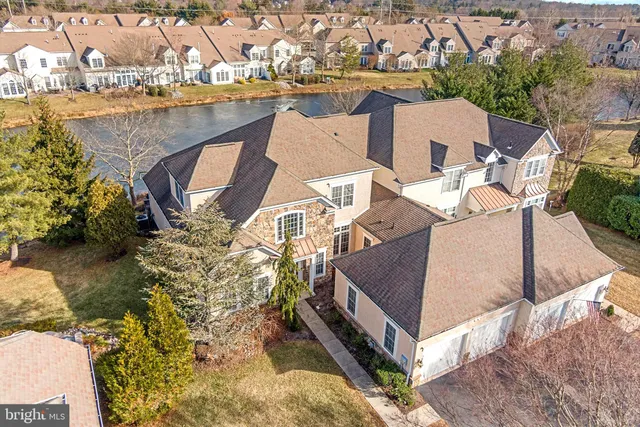 an aerial view of a house with lake view