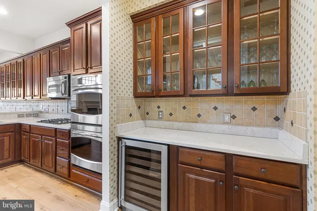 a kitchen with stainless steel appliances granite countertop a stove and a sink