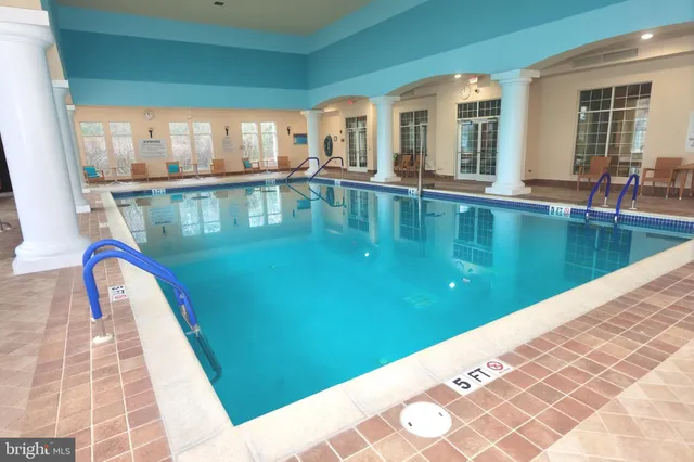 a view of swimming pool with outdoor seating