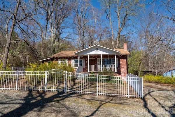 a front view of a house with a fence
