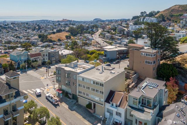 an aerial view of a city with lots of residential buildings