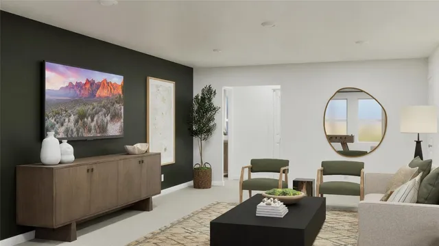 a living room with furniture a mirror and a flat screen tv