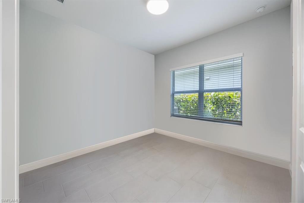 2401 Ariane Drive Naples, FL 34112 - Photo 11 of 17 an empty room with a window