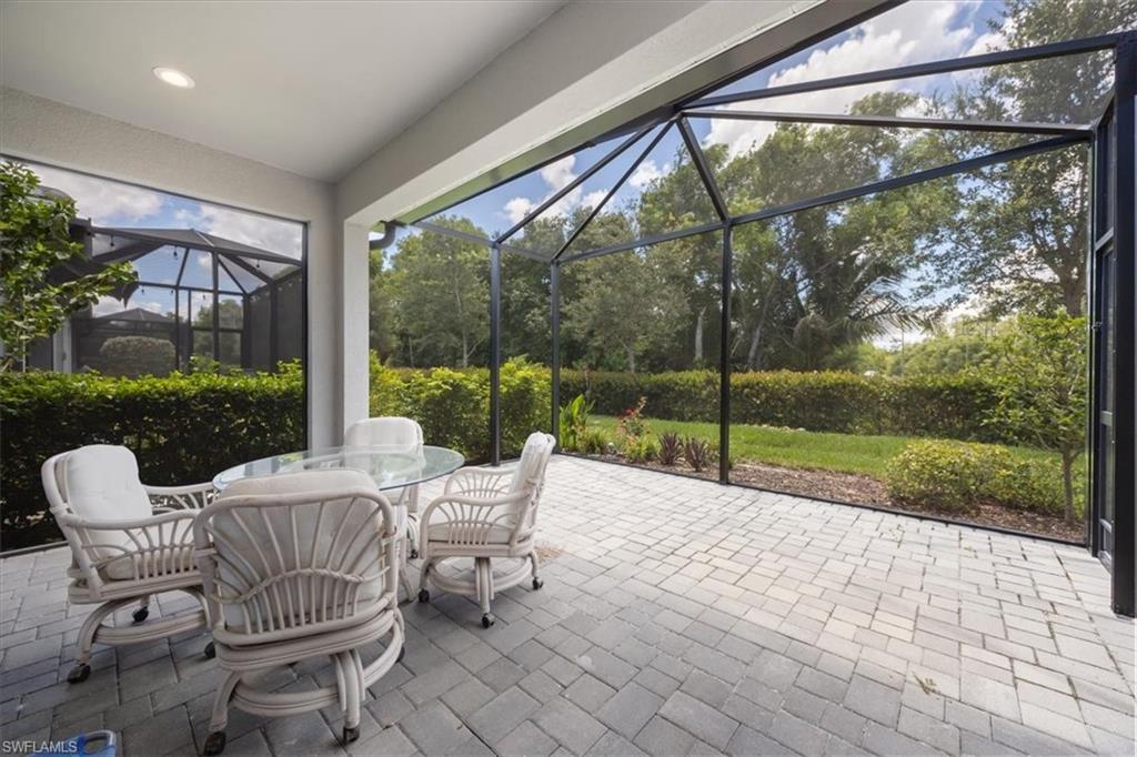 2401 Ariane Drive Naples, FL 34112 - Photo 12 of 17 a view of a patio with a backyard