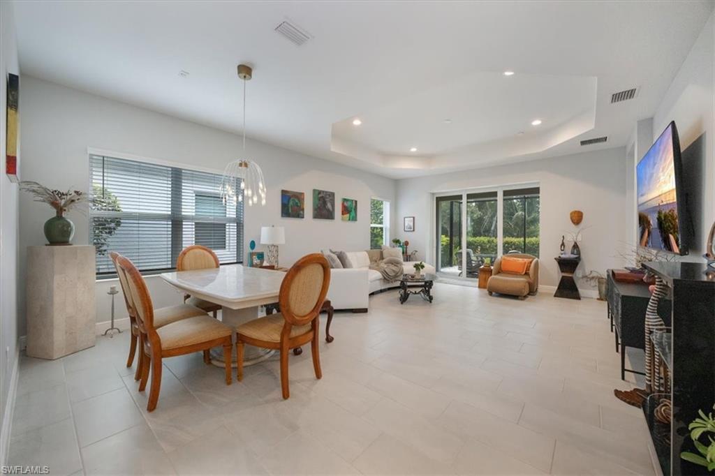 2401 Ariane Drive Naples, FL 34112 - Photo 3 of 17 a living room with furniture and a flat screen tv