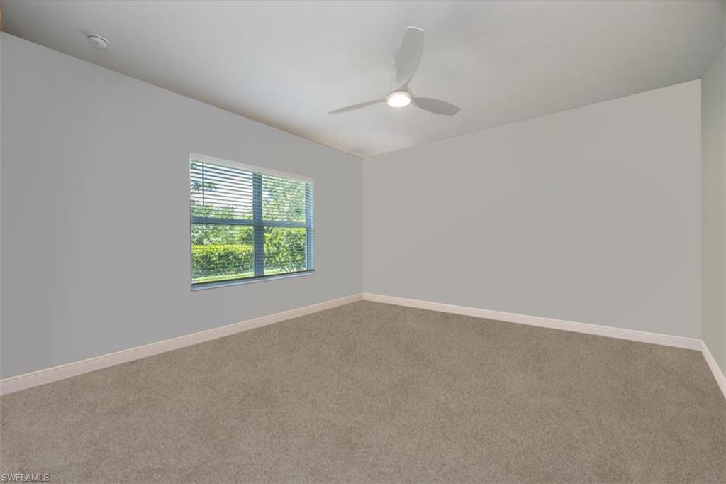 2401 Ariane Drive Naples, FL 34112 - Photo 6 of 17 an empty room with a window
