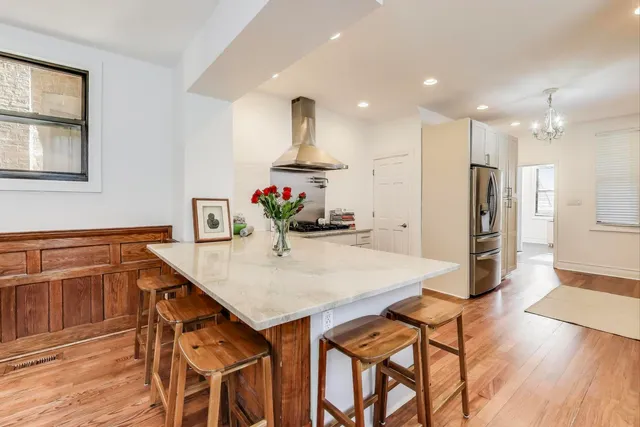 a kitchen with stainless steel appliances a refrigerator sink and cabinets