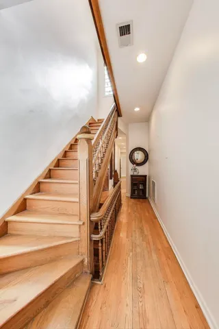 a bathroom with a double vanity sink a mirror and a shower