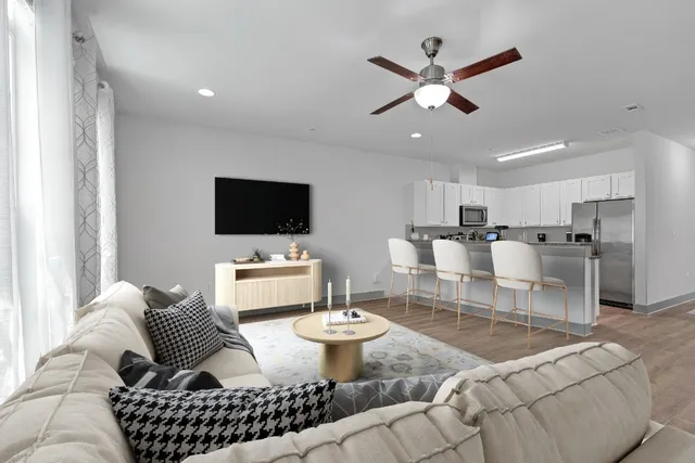 a living room with furniture and a flat screen tv