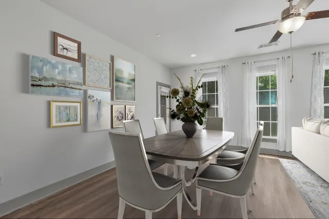a dining room with furniture and window