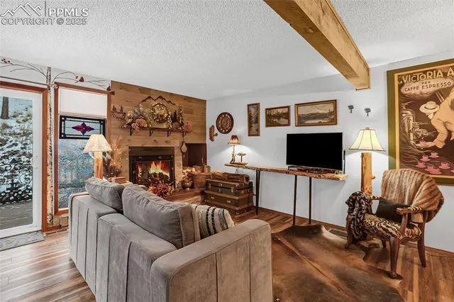 a view of a porch with furniture and wooden floor