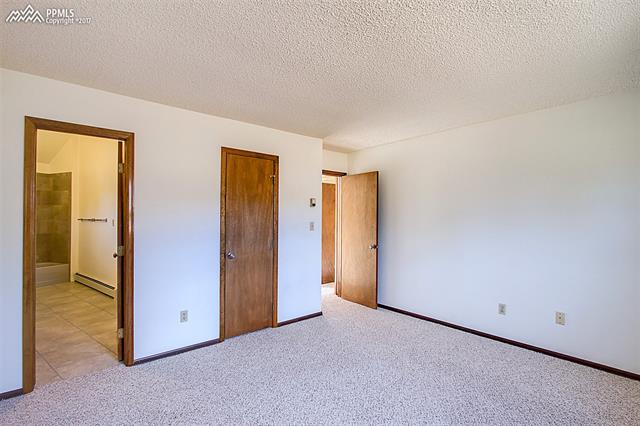 3780 Range View Road Monument, CO 80132 - Photo 20 of 33 Bedroom 3, has attached bath and walk in closet.