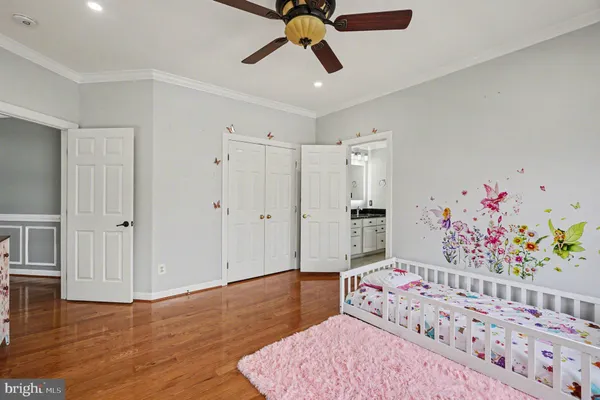 a bedroom with a bed and a table