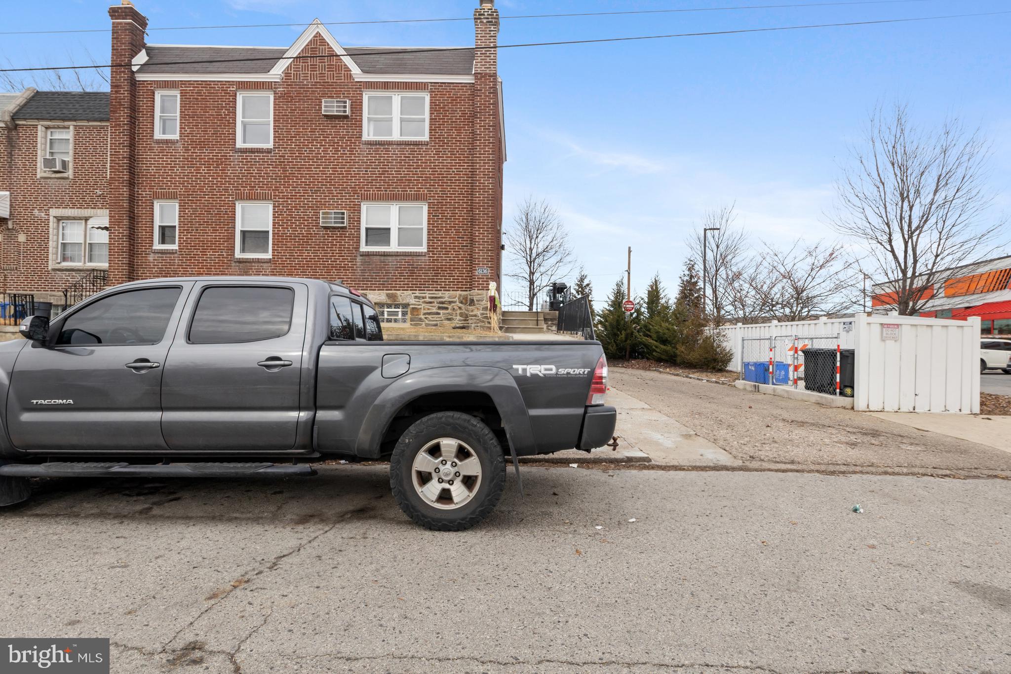 a front view of a house with parking space