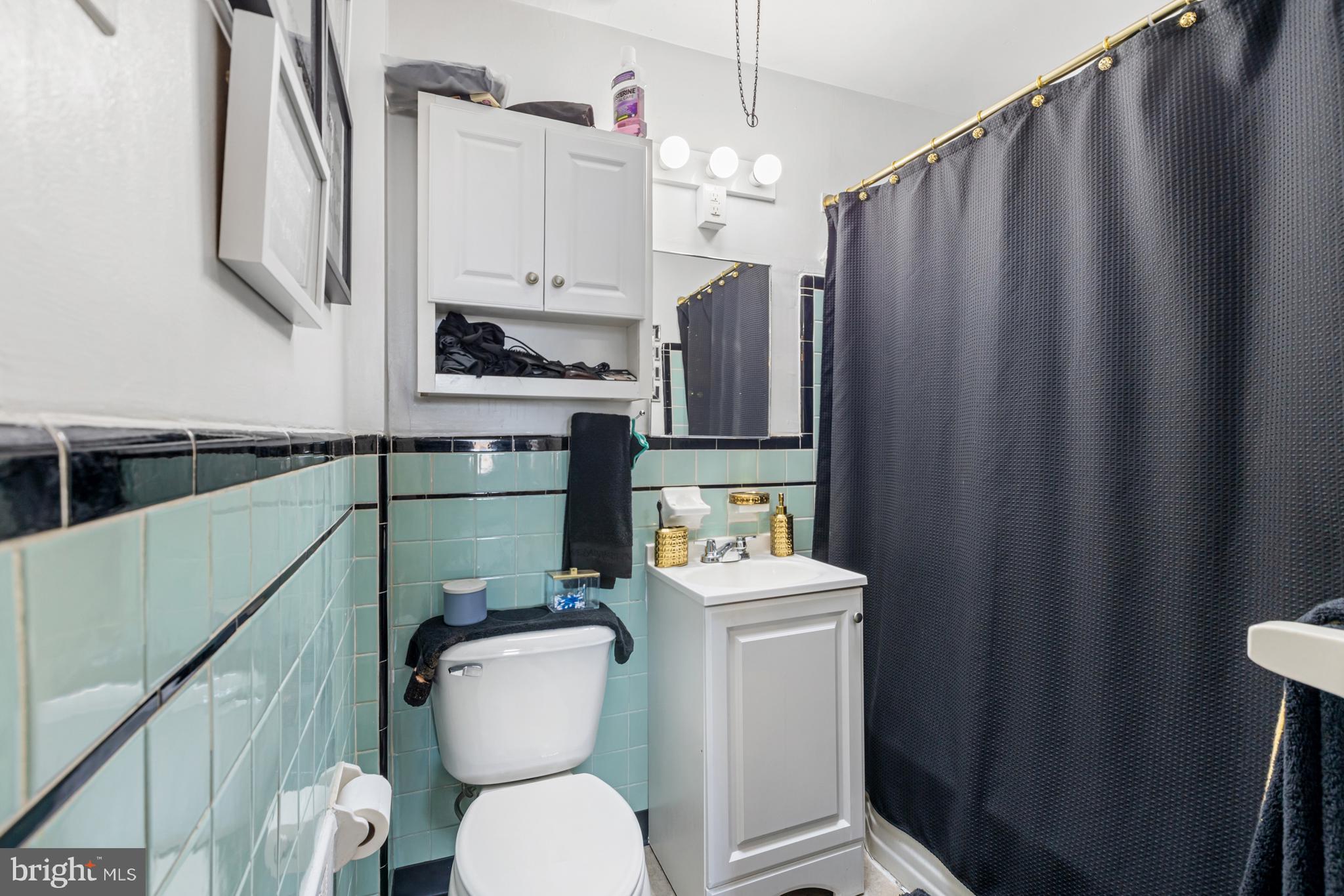 6136 Hawthorne Street Philadelphia, PA 19135 - Photo 11 of 38 a bathroom with a sink a toilet and a shower