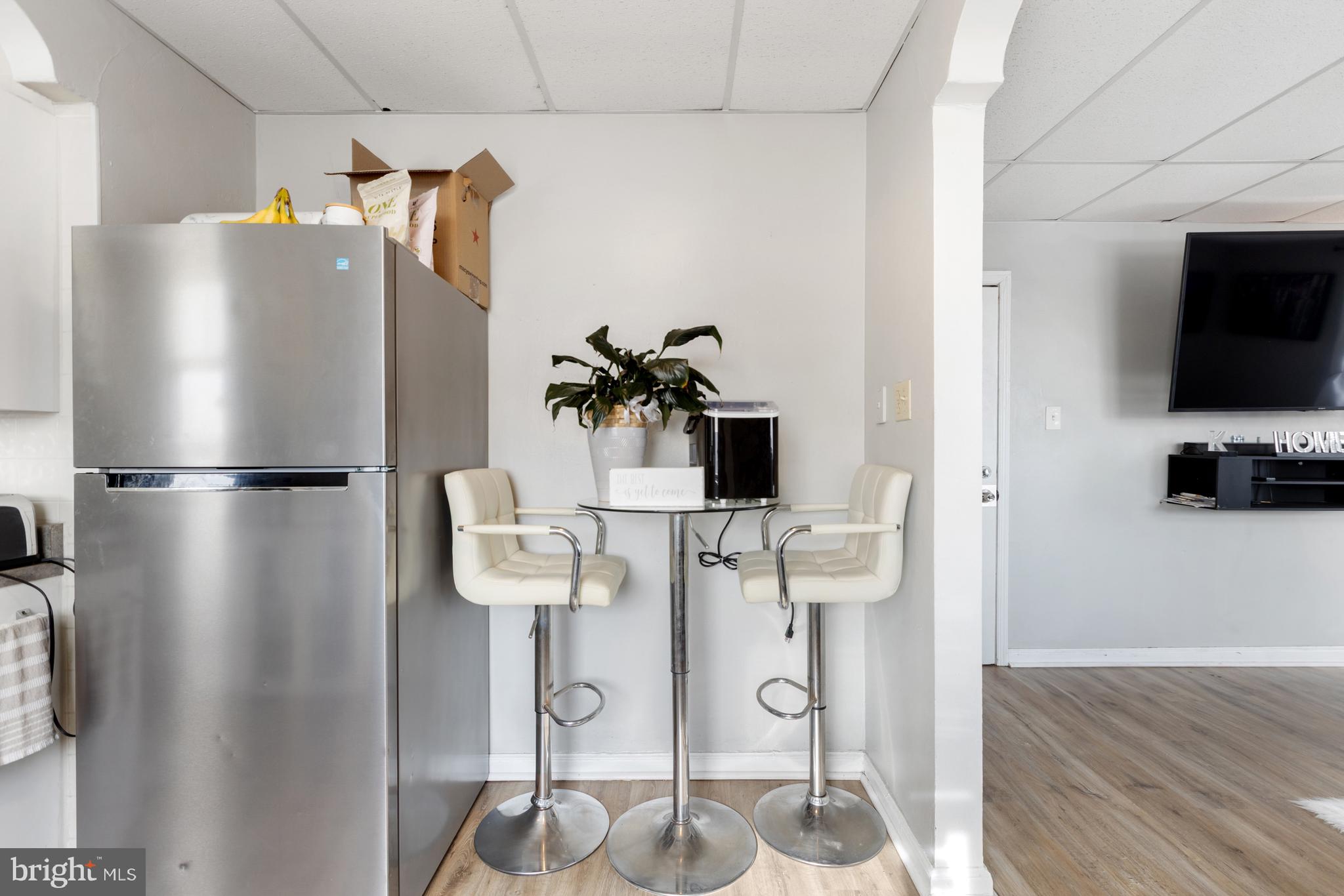 6136 Hawthorne Street Philadelphia, PA 19135 - Photo 21 of 38 a kitchen with stainless steel appliances refrigerator and microwave