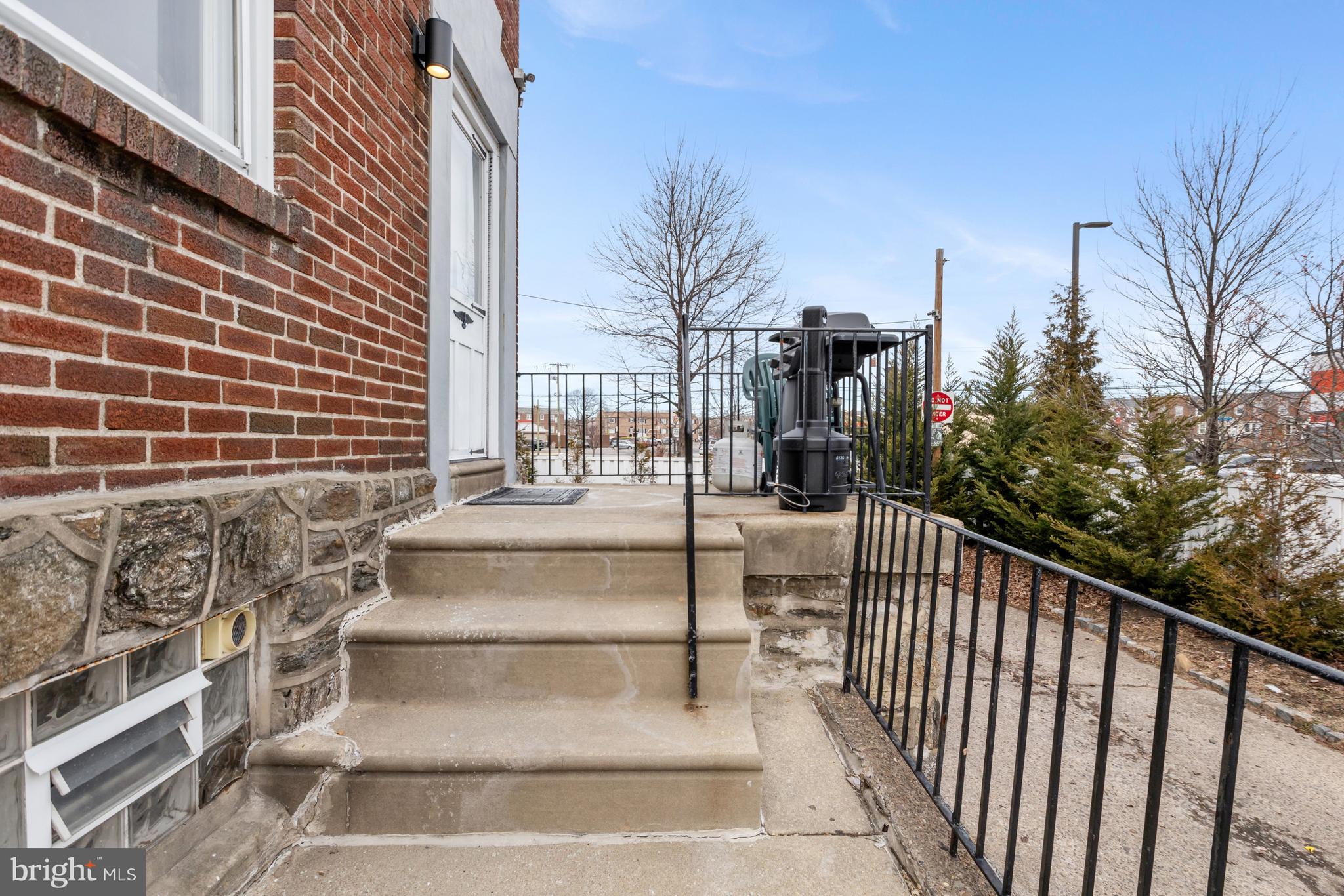 6136 Hawthorne Street Philadelphia, PA 19135 - Photo 3 of 38 a view of staircase with railing and trees