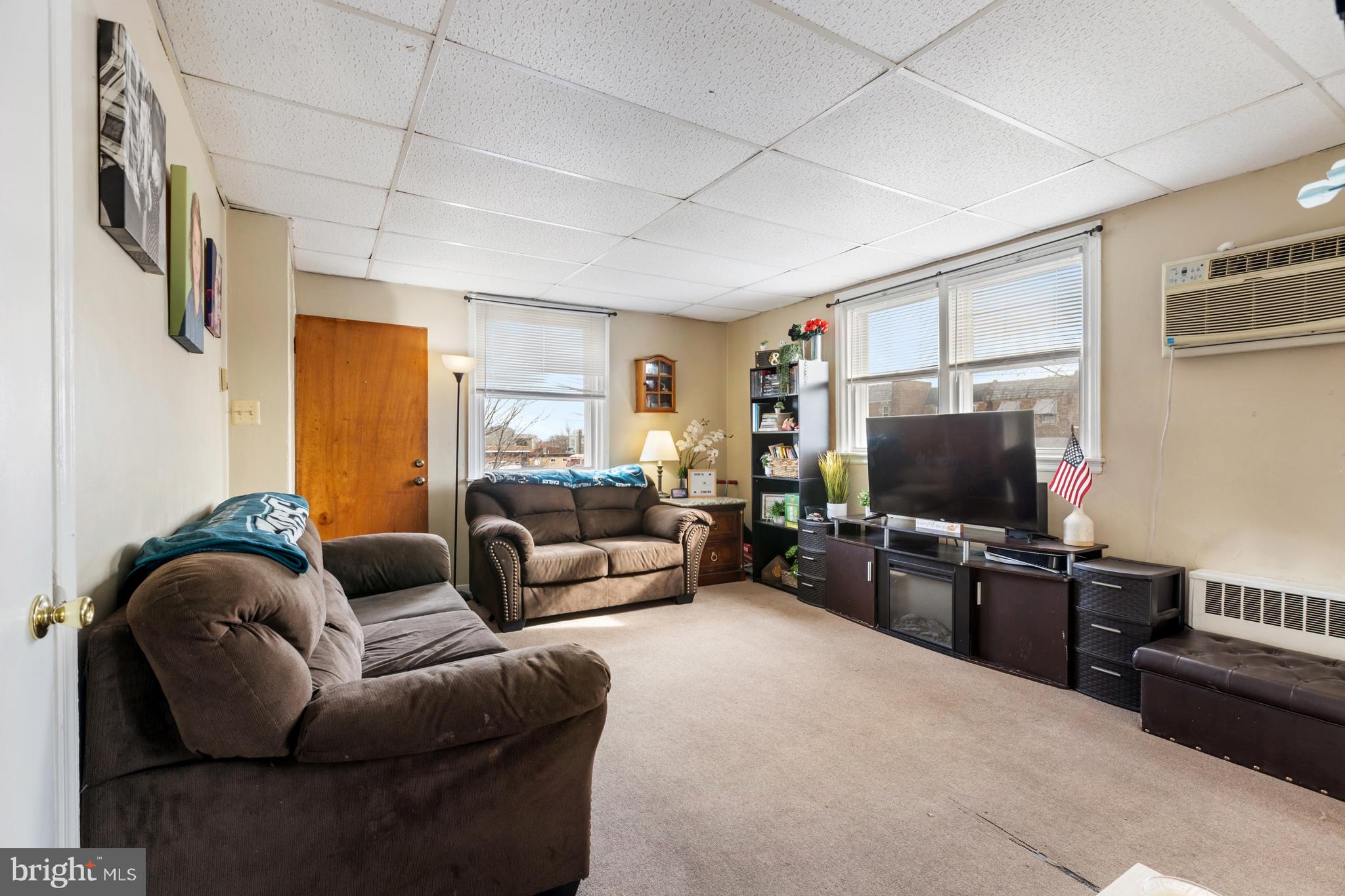 6136 Hawthorne Street Philadelphia, PA 19135 - Photo 5 of 38 a living room with furniture and a flat screen tv