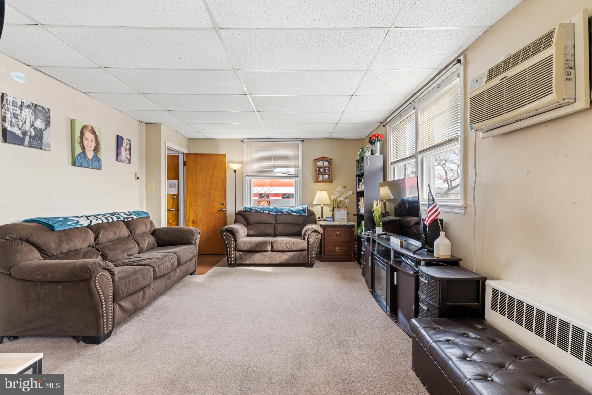 6136 Hawthorne Street Philadelphia, PA 19135 - Photo 6 of 38 a living room with furniture and a flat screen tv