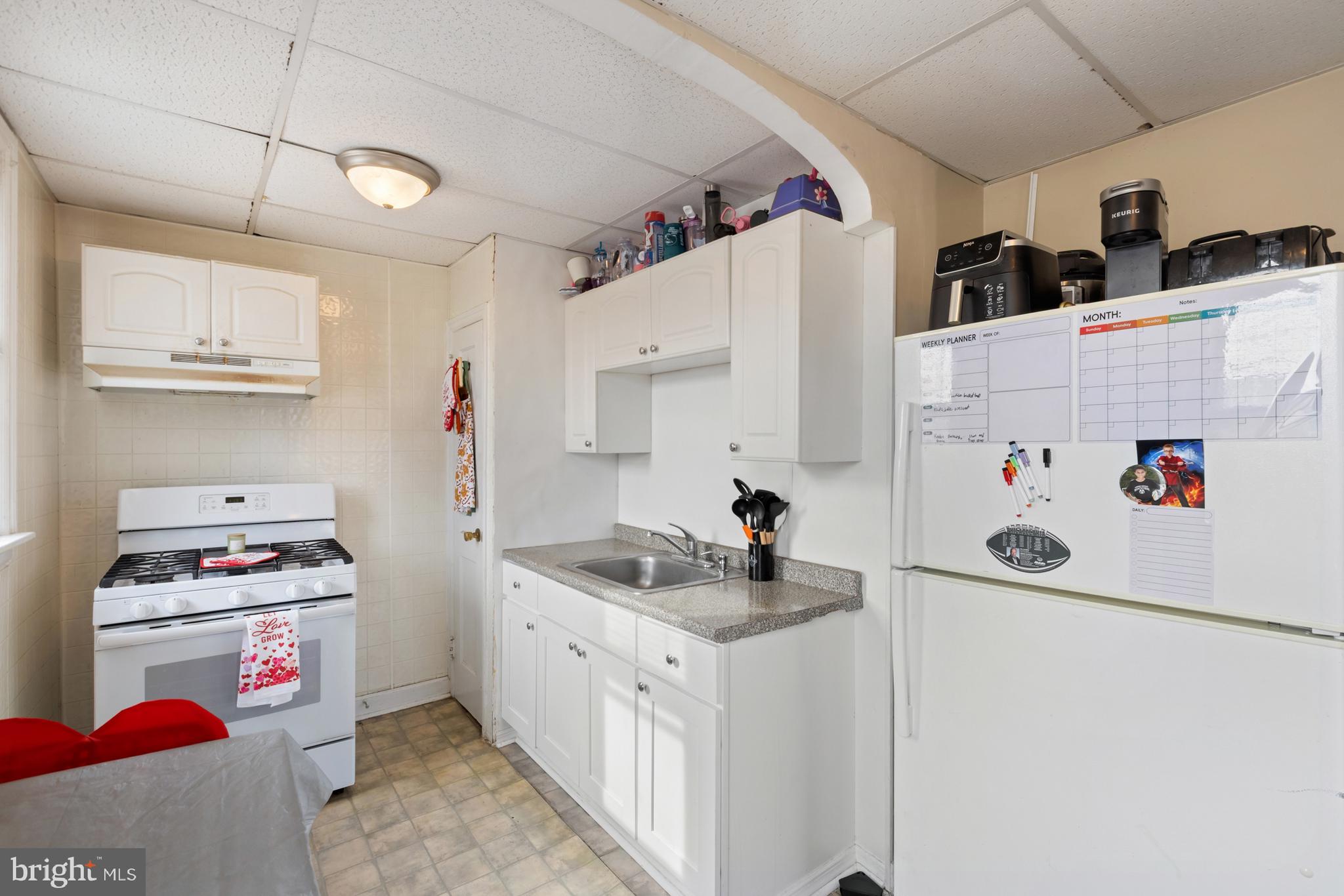 6136 Hawthorne Street Philadelphia, PA 19135 - Photo 9 of 38 a utility room with cabinets washer and dryer
