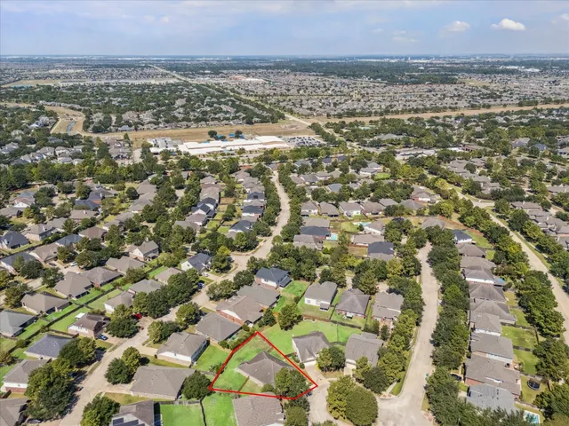 an aerial view of residential building with parking space