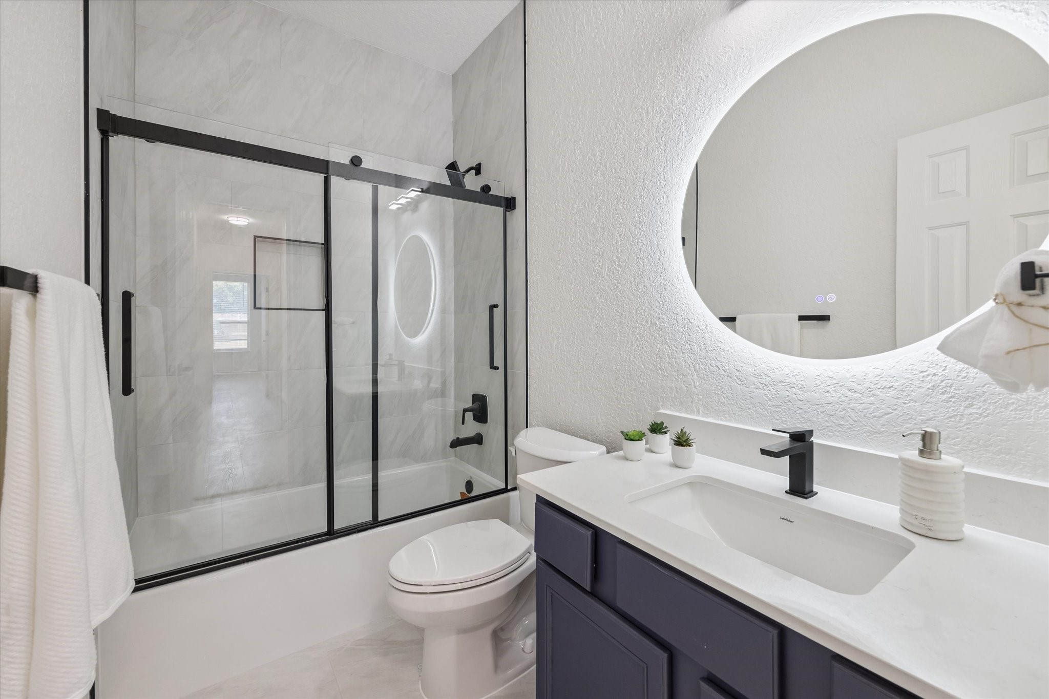 26110 Pointer Ridge Lane Katy, TX 77494 - Photo 22 of 25 a bathroom with a sink a toilet and shower a mirror