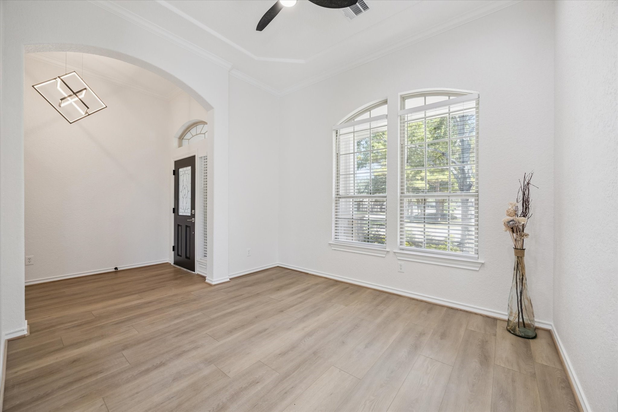 26110 Pointer Ridge Lane Katy, TX 77494 - Photo 6 of 25 a view of an empty room with a window and wooden floor