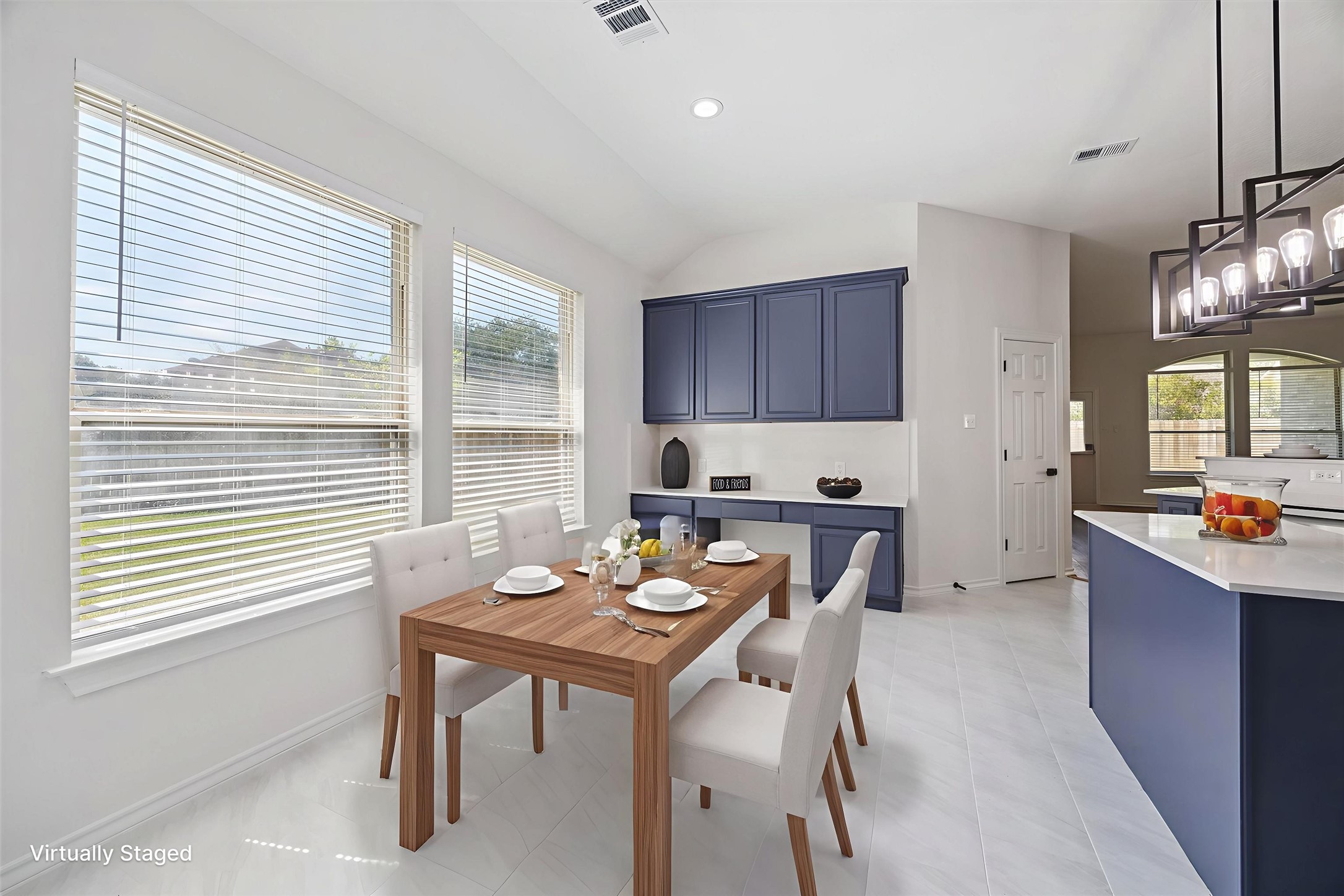 26110 Pointer Ridge Lane Katy, TX 77494 - Photo 10 of 25 a kitchen with a table chairs stove and cabinets