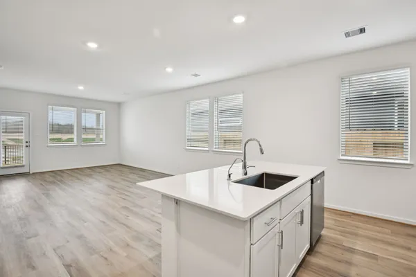 a kitchen with sink and window