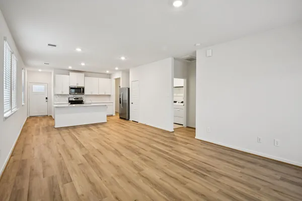 a view of kitchen and wooden floor