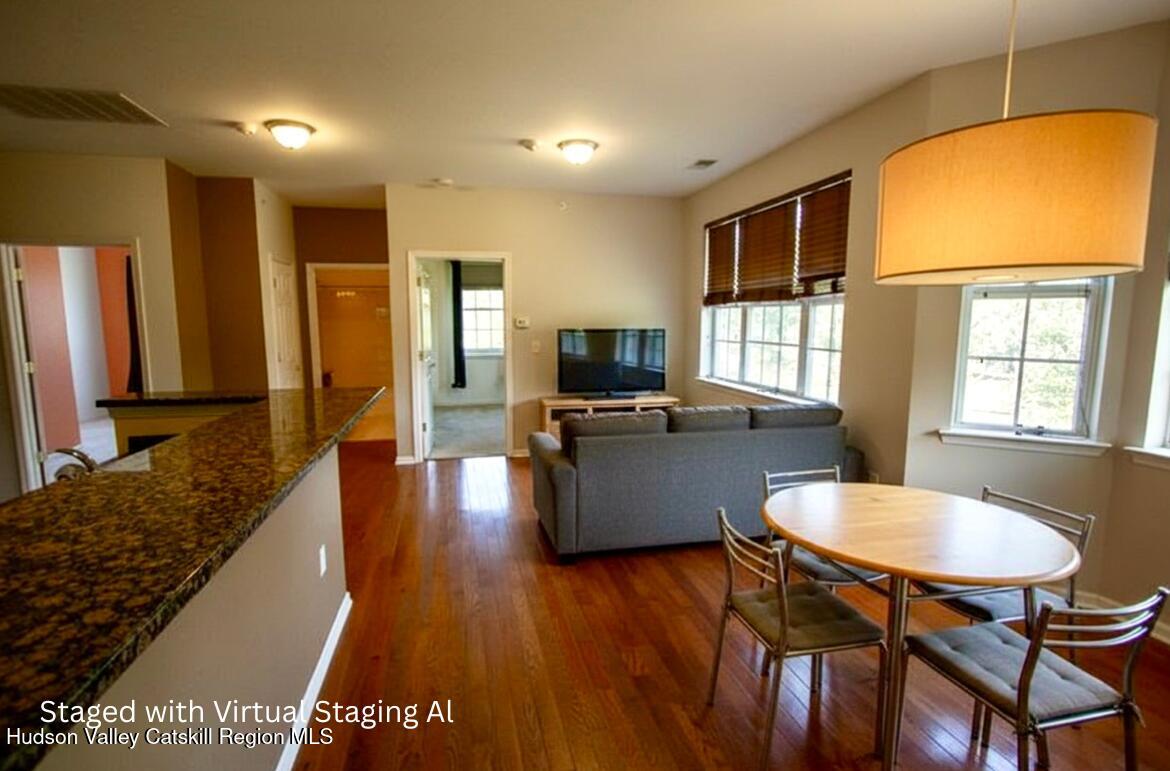 402 Commons Lane Saugerties, NY 12477 - Photo 16 of 29 a living room with furniture and a flat screen tv