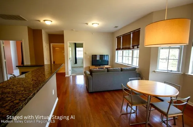 a kitchen with a refrigerator and a sink