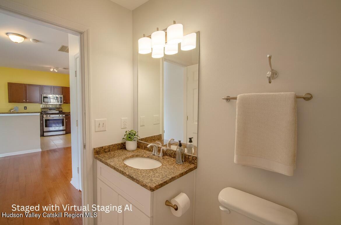 402 Commons Lane Saugerties, NY 12477 - Photo 21 of 29 a bathroom with a granite countertop sink a mirror and a shower