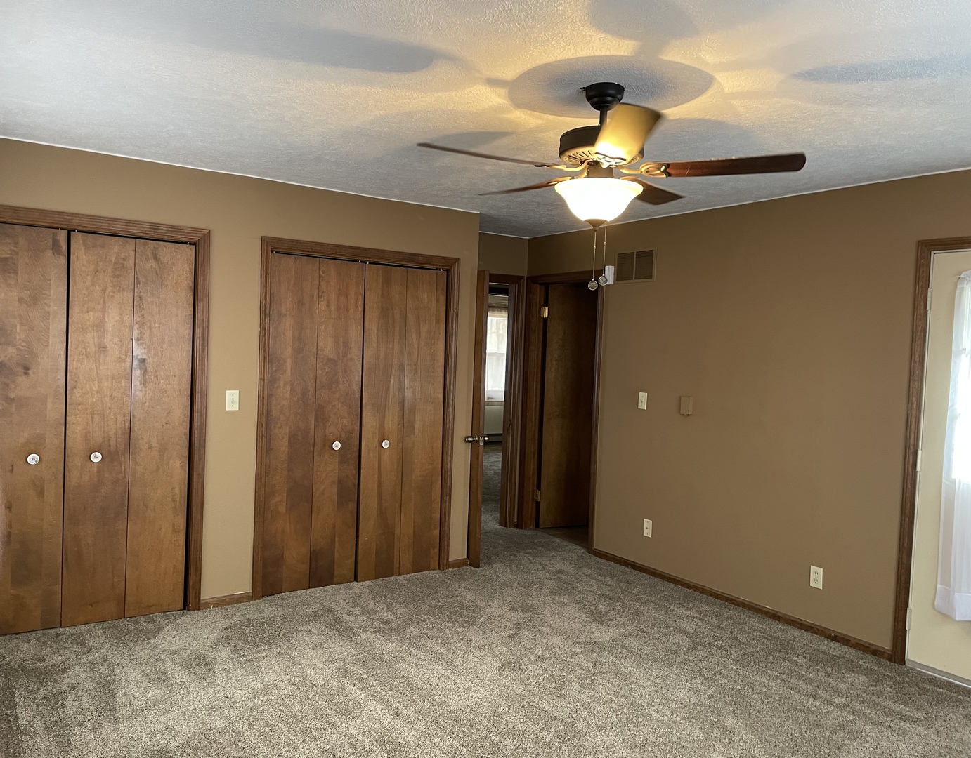 5650 West Bluff Road Morris, IL 60450 - Photo 20 of 53 a view of an empty room and chandelier fan and closet area
