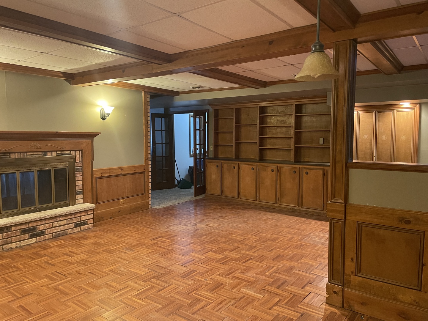 5650 West Bluff Road Morris, IL 60450 - Photo 32 of 53 an empty room with wooden floor and a fireplace