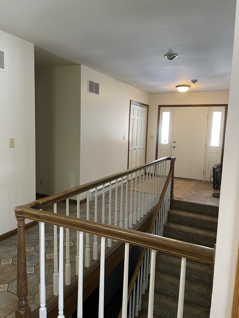 5650 West Bluff Road Morris, IL 60450 - Photo 7 of 53 a view of staircase with railing and white walls